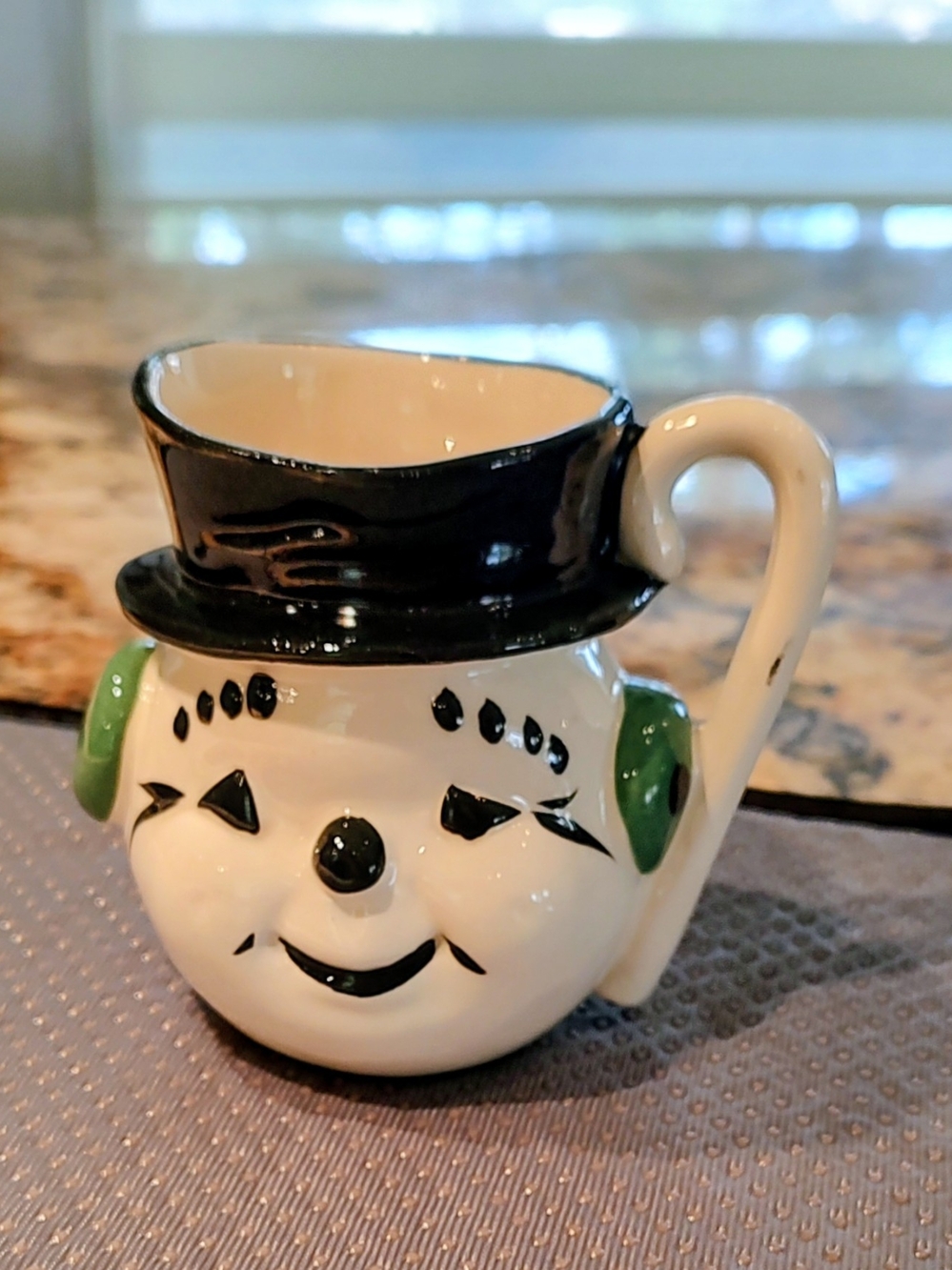 Festive Snowman Mug with Black Hat and Green Ear Covers